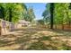 Expansive, private backyard enclosed by a wooden fence, offering plenty of space for recreation at 1333 Laura Ln, Austell, GA 30168