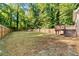Spacious, fenced backyard with a raised deck and ample room for outdoor activities at 1333 Laura Ln, Austell, GA 30168