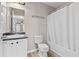 Bathroom featuring a vanity with a sink, a toilet, and a shower with a curtain at 1333 Laura Ln, Austell, GA 30168
