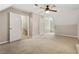 Bedroom featuring plush carpeting, a ceiling fan, and natural light at 1333 Laura Ln, Austell, GA 30168