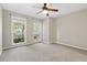 Bedroom featuring neutral paint, plush carpeting, and natural light from the windows at 1333 Laura Ln, Austell, GA 30168