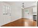 Dining room with hardwood floors, light fixture, and two exterior doors at 1333 Laura Ln, Austell, GA 30168