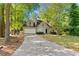 Charming two-story home with a well-manicured lawn and a spacious driveway leading to a two-car garage at 1333 Laura Ln, Austell, GA 30168