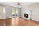 Living room featuring hardwood floors, a fireplace, and a large window at 1333 Laura Ln, Austell, GA 30168
