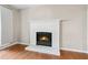 Living room featuring hardwood floors, a fireplace, and neutral paint at 1333 Laura Ln, Austell, GA 30168