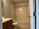 Full bathroom with tiled shower-tub, toilet, and vanity with wood cabinets at 17301 Waldrop Cv, Decatur, GA 30034