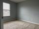 Bedroom with natural light from window and neutral paint at 17301 Waldrop Cv, Decatur, GA 30034