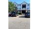 Well-maintained apartment building featuring assigned parking and classic architectural details at 17301 Waldrop Cv, Decatur, GA 30034