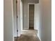 Neutral hallway area with access to multiple rooms and closets at 17301 Waldrop Cv, Decatur, GA 30034