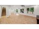 Large basement area with bright lighting, wood-look flooring, and multiple windows at 2585 Drew Valley Ne Rd, Brookhaven, GA 30319