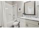 Bathroom features a white tiled shower and marble countertop vanity at 2585 Drew Valley Ne Rd, Brookhaven, GA 30319