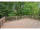 Large wooden deck overlooking lush greenery and trees at 2585 Drew Valley Ne Rd, Brookhaven, GA 30319