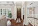 Entryway features hardwood floors, wainscoting, and access to the formal living room at 2585 Drew Valley Ne Rd, Brookhaven, GA 30319