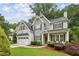 Charming home with inviting curb appeal featuring a lush lawn and meticulously maintained landscaping at 2585 Drew Valley Ne Rd, Brookhaven, GA 30319