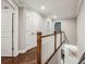 Upstairs hallway features hardwood flooring and a decorative banister at 2585 Drew Valley Ne Rd, Brookhaven, GA 30319