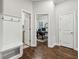 Hallway with hardwood flooring, a coat rack and bench, and access to the office at 2585 Drew Valley Ne Rd, Brookhaven, GA 30319