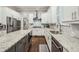 Spacious kitchen features stainless appliances, white cabinets, granite countertops, and hardwood flooring at 2585 Drew Valley Ne Rd, Brookhaven, GA 30319