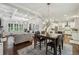 Open concept floor plan showcasing the living room, dining area, and kitchen with hardwood floors and elegant lighting at 2585 Drew Valley Ne Rd, Brookhaven, GA 30319