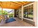 Charming covered porch showcasing natural light with backyard views at 3845 Glen Ian Dr, Loganville, GA 30052