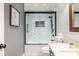 Updated bathroom featuring a tub, framed mirror, and stone countertop at 3845 Glen Ian Dr, Loganville, GA 30052