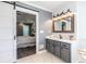 Bathroom showcases a sliding barn door leading to the main bedroom, plus modern vanity and fixtures at 3845 Glen Ian Dr, Loganville, GA 30052