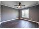 Bedroom with hardwood floors, gray walls, window and trim at 3845 Glen Ian Dr, Loganville, GA 30052