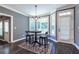 Cozy breakfast nook with lots of natural light, wood floors, stylish lighting, and seating at 3845 Glen Ian Dr, Loganville, GA 30052