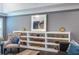 Living room with built-in shelves, offering ample storage and display space alongside stylish decor at 3845 Glen Ian Dr, Loganville, GA 30052