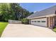 Wide driveway and attached three car garage with ample parking space at 3845 Glen Ian Dr, Loganville, GA 30052