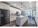 Stylish kitchen featuring a large island, modern appliances, and sleek cabinetry for a contemporary look at 3845 Glen Ian Dr, Loganville, GA 30052