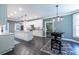 Large kitchen with gray walls and white cabinets, stone countertops, stainless appliances and center island at 3845 Glen Ian Dr, Loganville, GA 30052