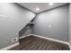 A spacious laundry room features gray walls, wood flooring, and under-stair shelving, ready for appliances at 3845 Glen Ian Dr, Loganville, GA 30052