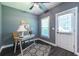 Functional office area with wood-look floors, natural light, and a door to the outside at 3845 Glen Ian Dr, Loganville, GA 30052