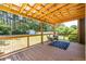 Outdoor porch with wooden roof, metal railing and wicker furniture at 3845 Glen Ian Dr, Loganville, GA 30052