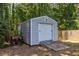 Spacious backyard storage shed with roll up door and easy backyard access at 3845 Glen Ian Dr, Loganville, GA 30052