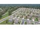 An aerial view of a residential neighborhood with many homes surrounded by lush green trees at 1173 Gaines St, Jonesboro, GA 30238