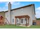 Backyard view featuring a pergola covered patio, playset, grassy lawn, and rear home elevation at 1173 Gaines St, Jonesboro, GA 30238
