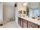 Bathroom with double sinks, granite countertop vanity, and walk-in shower at 1173 Gaines St, Jonesboro, GA 30238