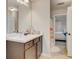 Secondary bathroom with a dark wood vanity and a large mirror at 1173 Gaines St, Jonesboro, GA 30238