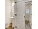 Charming half-bath features a pedestal sink, decorative mirror, and stylish lighting at 1173 Gaines St, Jonesboro, GA 30238
