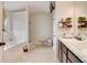 Bathroom with double sinks, granite countertop vanity, and soaking tub at 1173 Gaines St, Jonesboro, GA 30238
