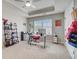Bright bedroom with a desk, a rolling chair, and closet storage at 1173 Gaines St, Jonesboro, GA 30238