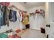 Walk-in closet with hanging racks and shoe storage providing ample storage space at 1173 Gaines St, Jonesboro, GA 30238
