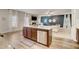 Kitchen with large island, stainless appliances, and breakfast bar with view into the living room at 1173 Gaines St, Jonesboro, GA 30238