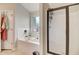 Bathroom featuring a soaking tub, a separate shower, and white tiled walls at 1173 Gaines St, Jonesboro, GA 30238