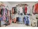 Walk-in closet with built-in shelving and ample storage space for clothes and accessories at 1173 Gaines St, Jonesboro, GA 30238