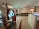 Open-concept living space with fireplace, neutral carpet, and dining area at 2863 Hillvale Cove Dr, Lithonia, GA 30058