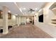 Spacious basement with carpet flooring, built-in shelving, and ample lighting at 3332 Heathchase Ln, Suwanee, GA 30024