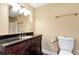 Bathroom offering a dark wood vanity with a granite countertop at 3332 Heathchase Ln, Suwanee, GA 30024