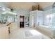 Bright bathroom with a soaking tub, large vanity, and walk-in closet at 3332 Heathchase Ln, Suwanee, GA 30024